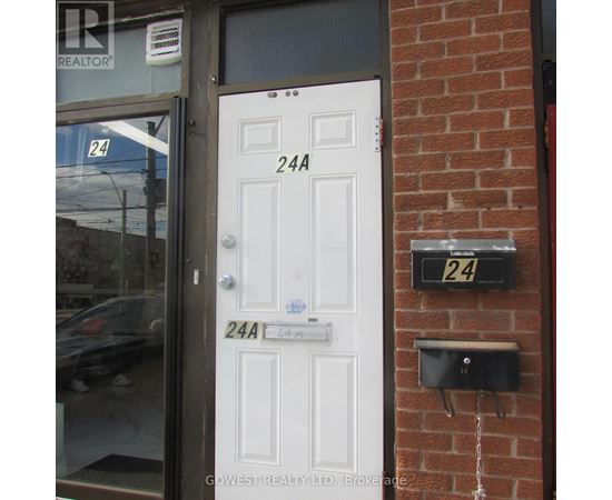 A white door with a sign that says 24A.