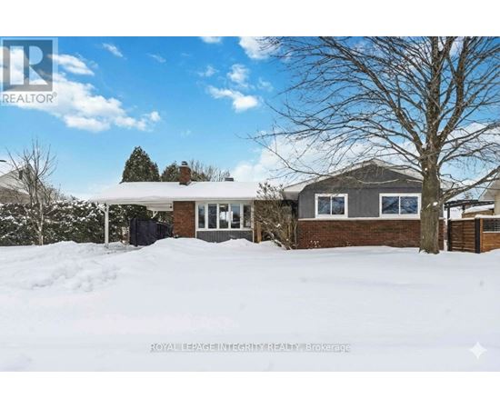 A house with a snow-covered ground in front of it.
