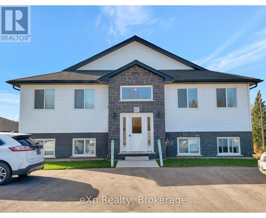 A house with a white door and windows is for sale.