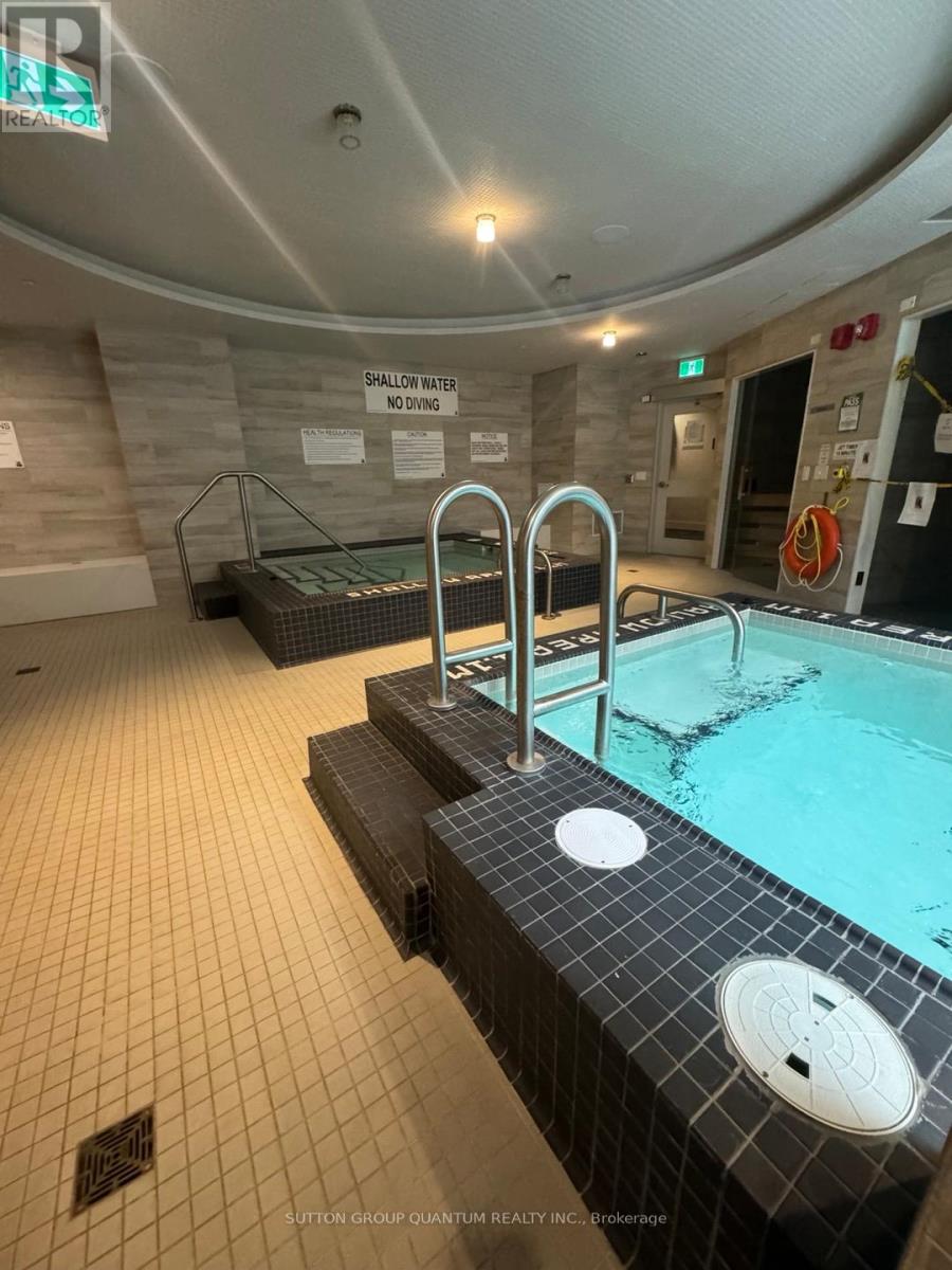 A swimming pool with a sign that says "Shallow Water No Diving".