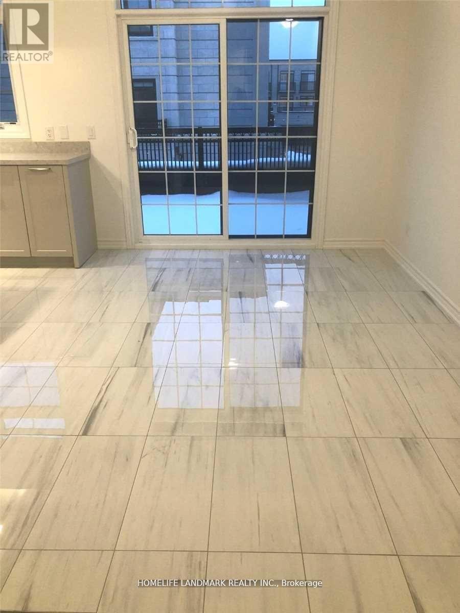 A view of a floor with tiles and a cabinet with a window in the background.