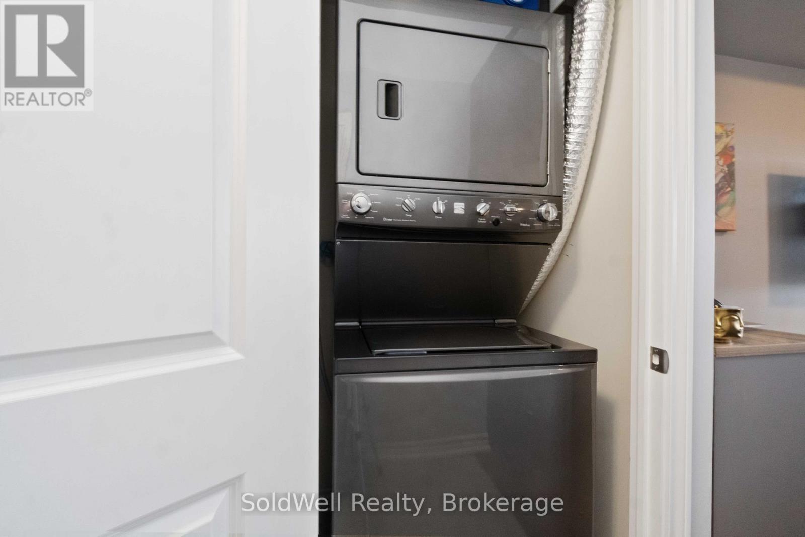 A stainless steel oven with a microwave above it is installed in a kitchen.