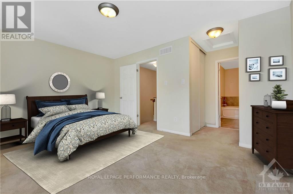 A bedroom with a bed, nightstand, and a dresser.