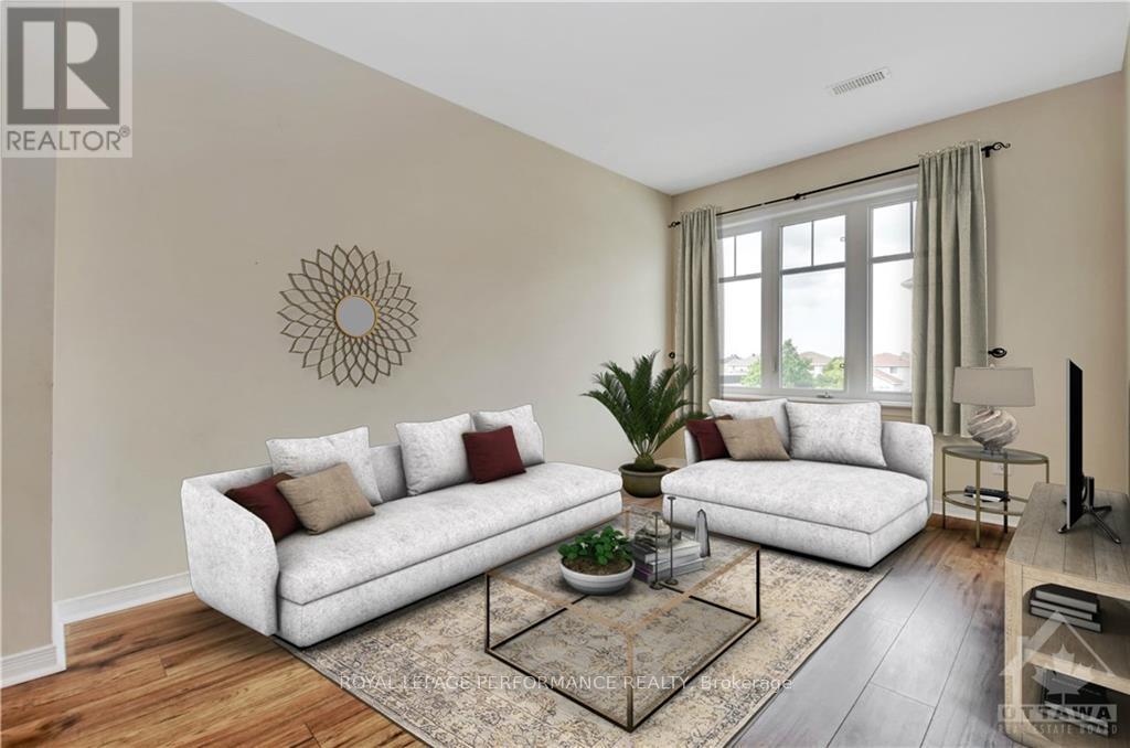 A living room with a white sofa and a glass coffee table.