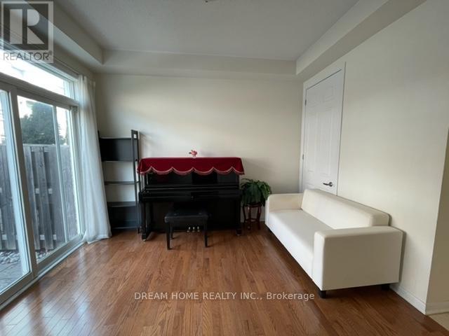 A living room with a red couch and a white sofa.