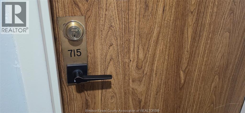A door with a lock and a number plate on it.