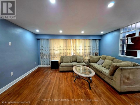 A living room with a brown sofa and a glass coffee table.