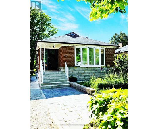A house with a brick facade and a white door.