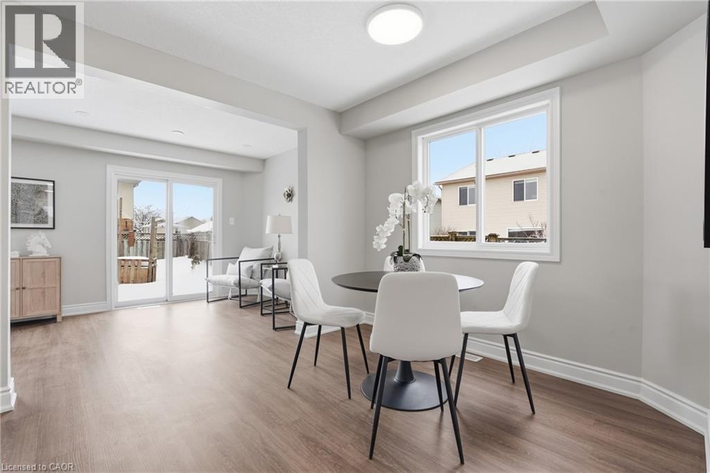 A dining room with a table set for four.