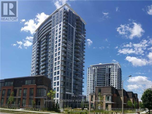 A tall residential building stands next to a shorter brick building.