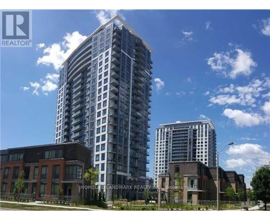 A tall residential building stands next to a shorter brick building.
