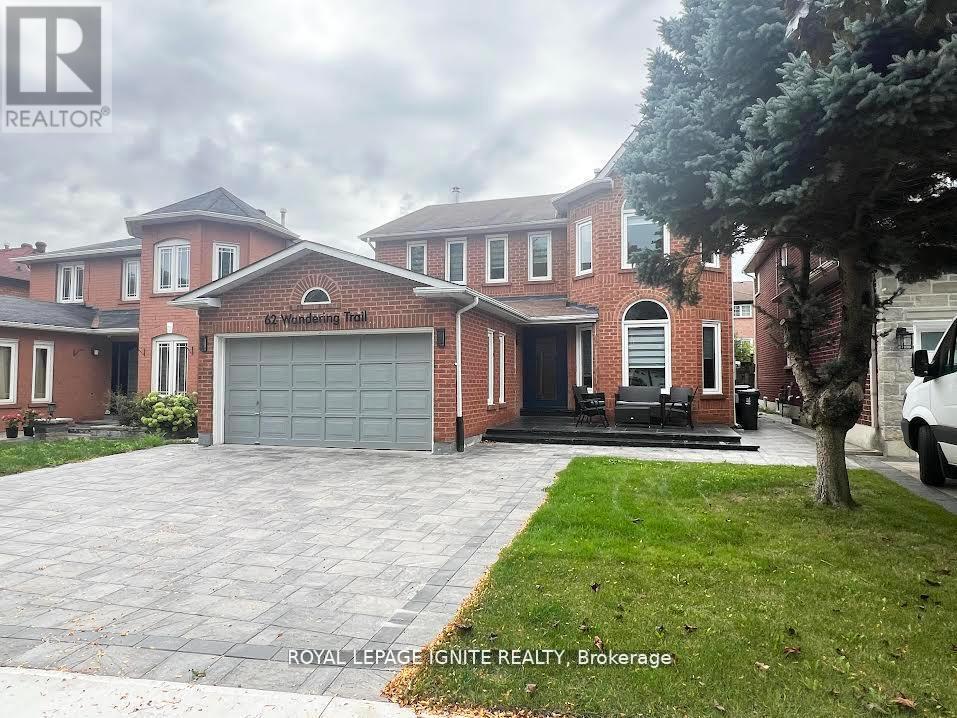 A large brick house with a garage is for sale.