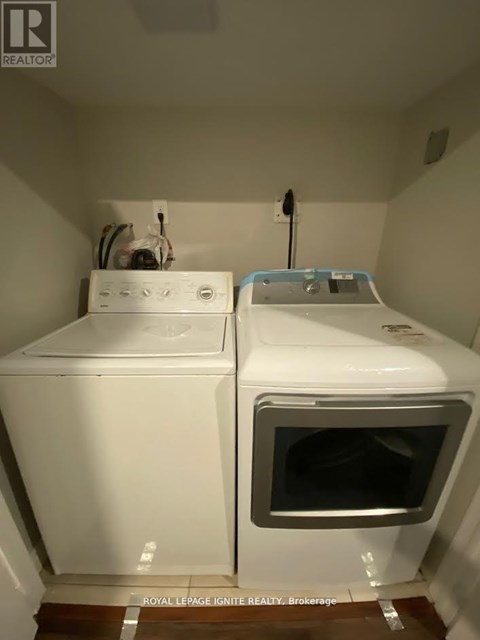 A white oven and microwave in a small kitchen.