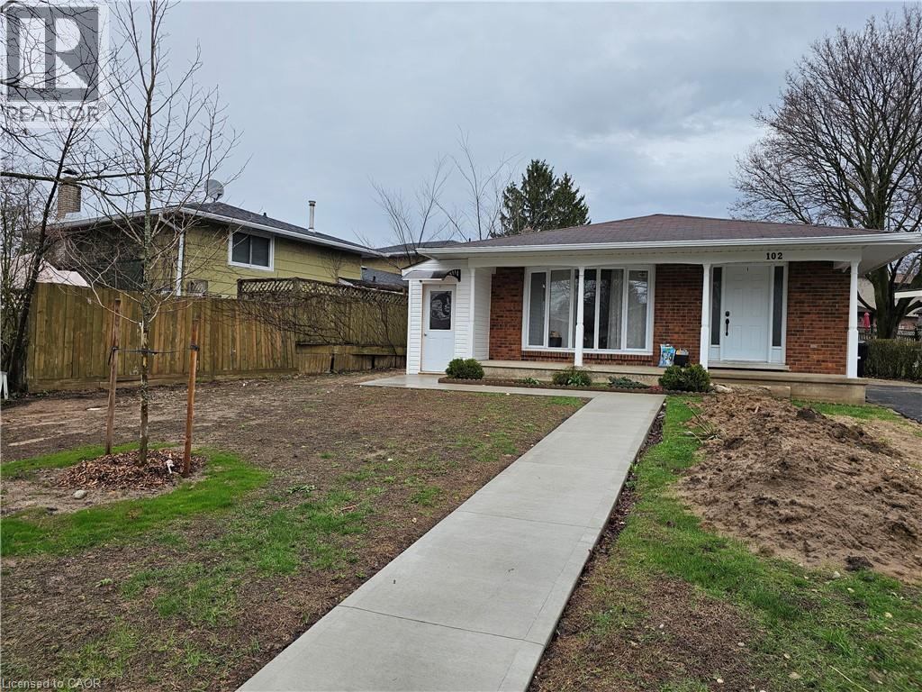 A house with a white door and a brown fence.