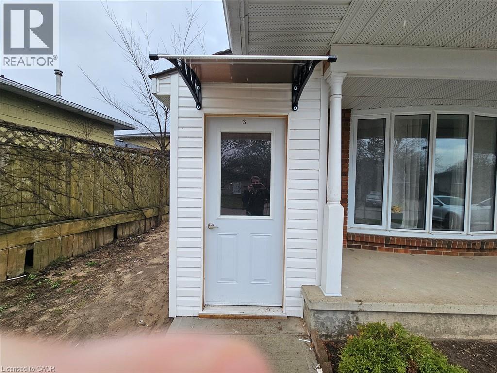 A white door is on the left side of a house.