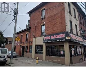 A brick building with a sign that says wing machine.