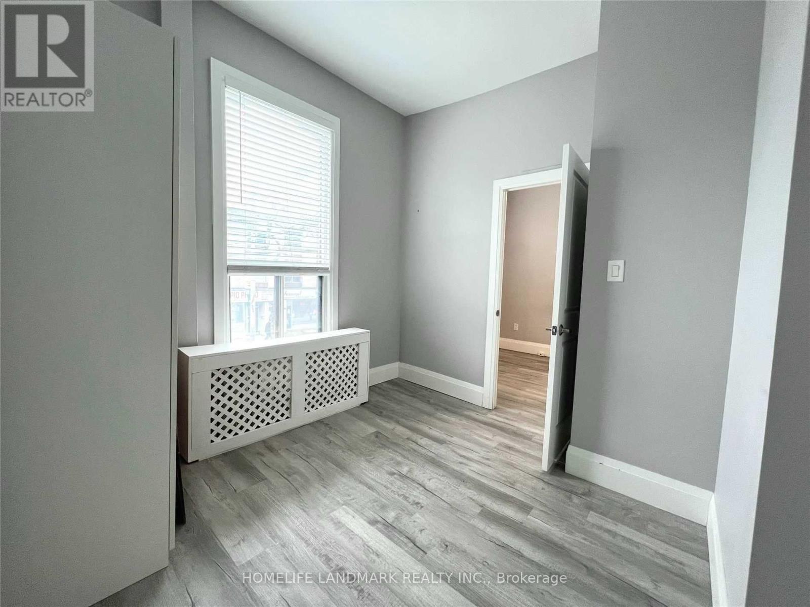 A room with a window and a door is on the market.