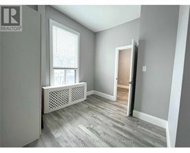 A room with a window and a door is on the market.
