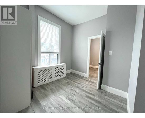 A room with a window and a door is on the market.