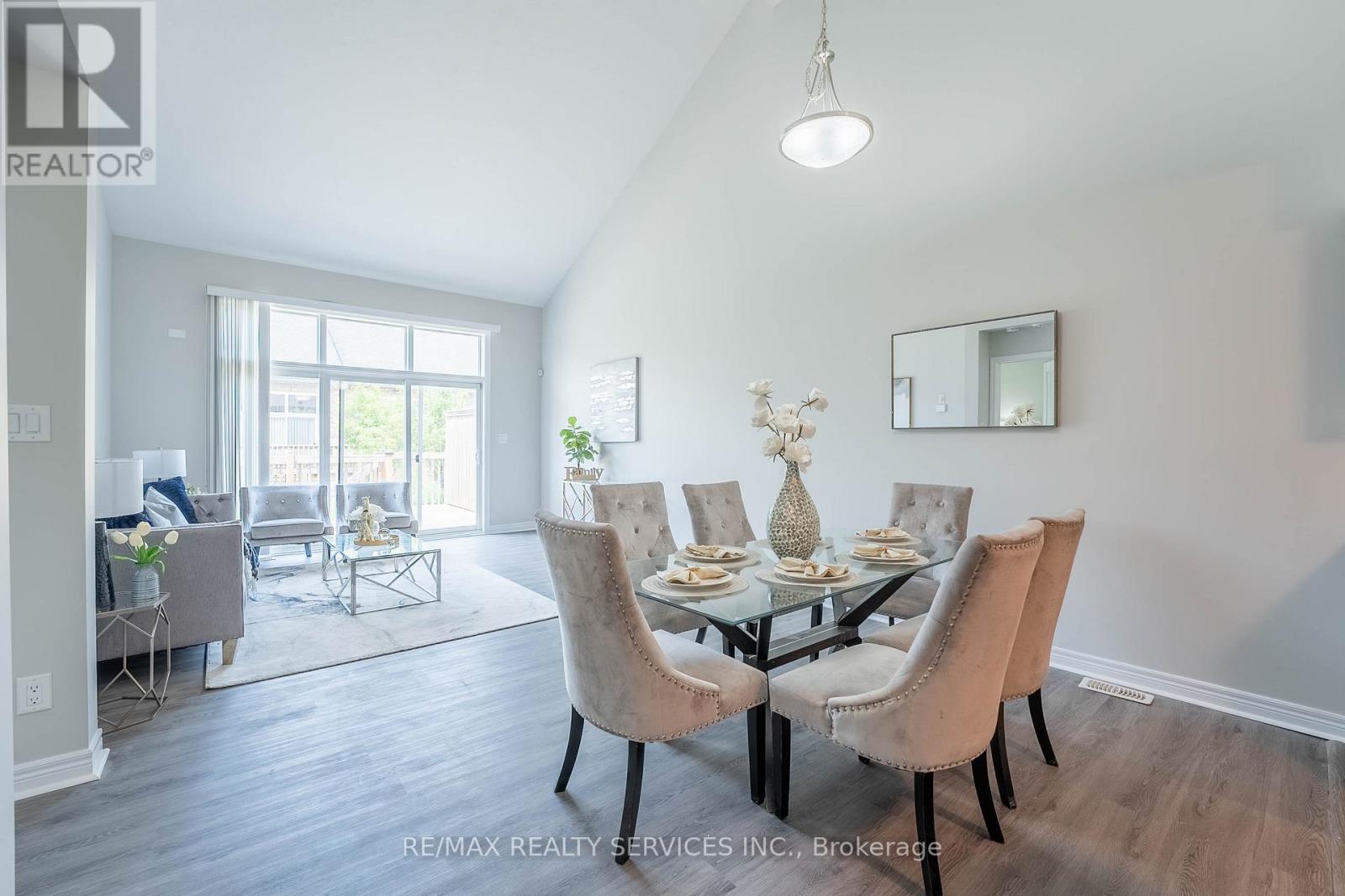 A dining room with a table set for six.