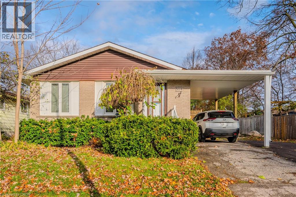 A house with a car parked in front of it.