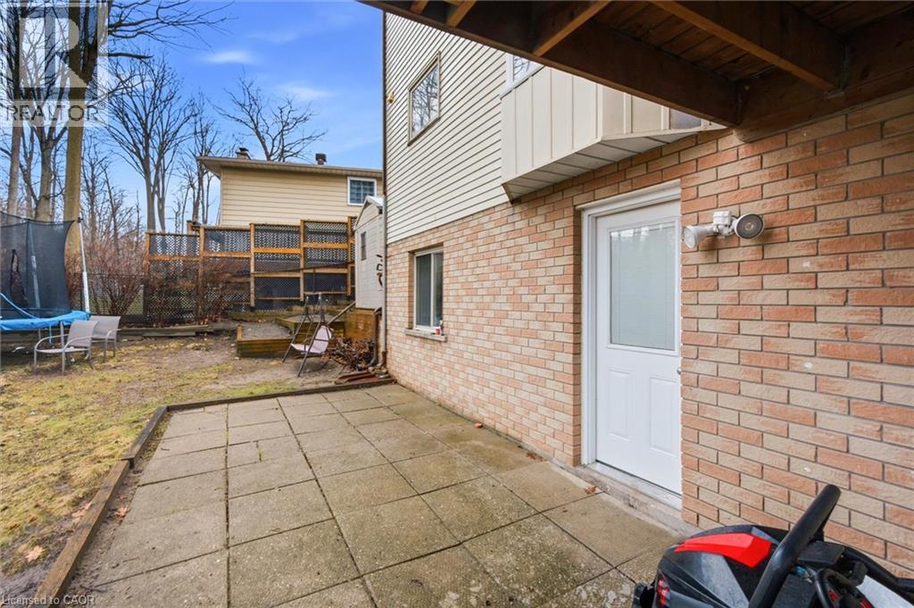 A backyard with a patio and a small garden.