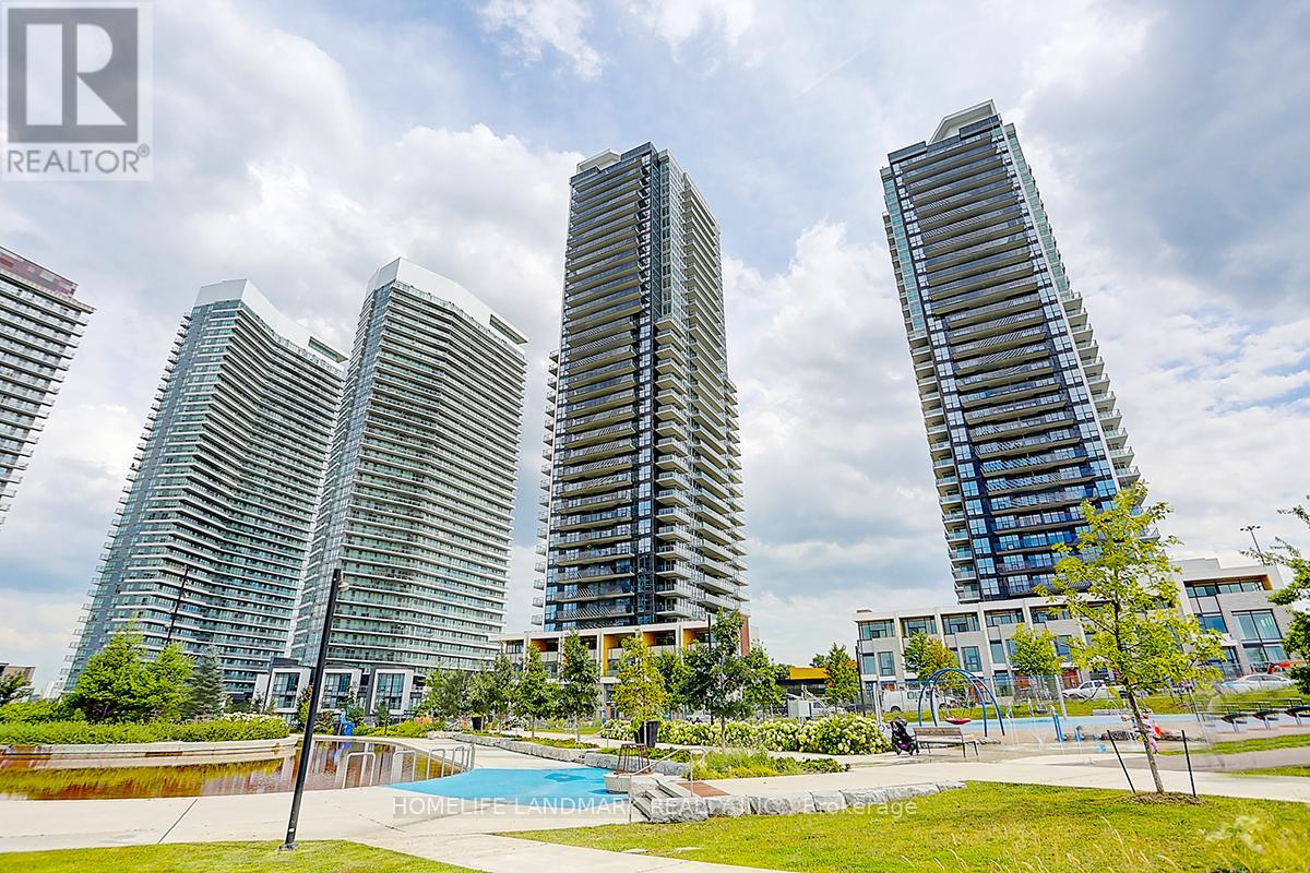 A group of modern high-rise buildings with a swimming pool in the foreground.