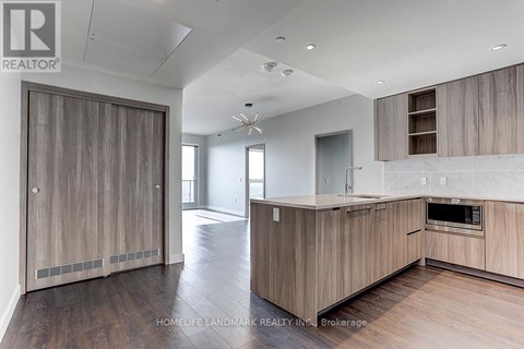A modern kitchen with wooden cabinets and a large island.