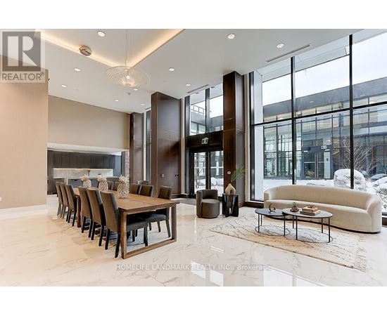A large, modern dining room with a long table and chairs.