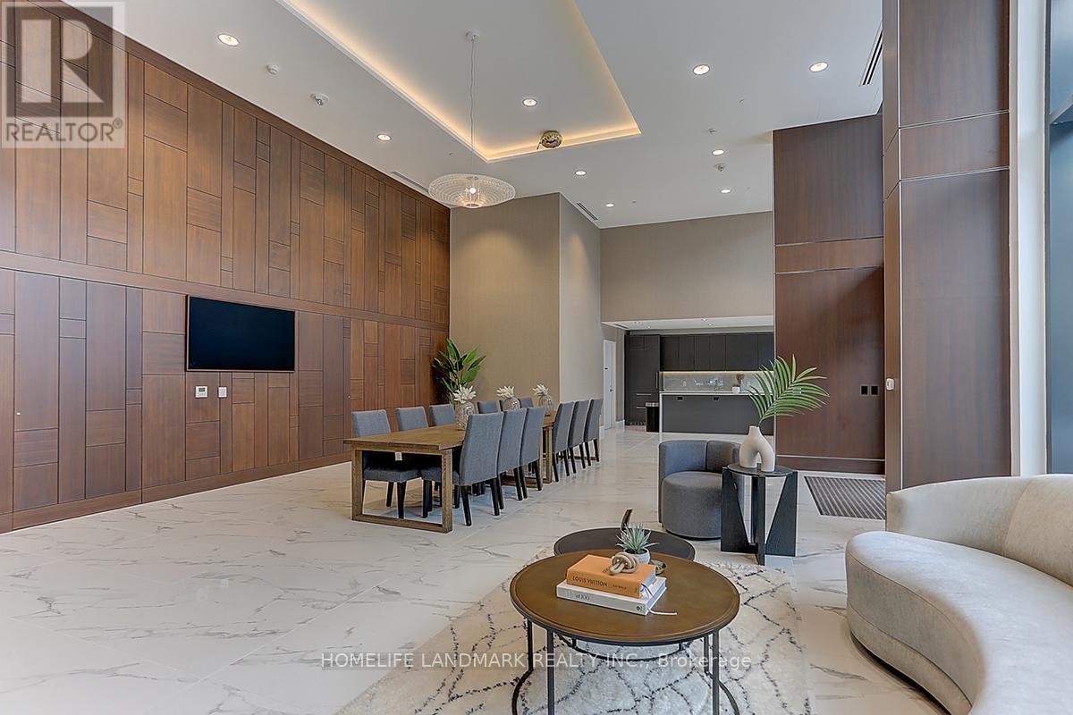 A modern living room with a wooden accent wall and a large flat-screen TV.