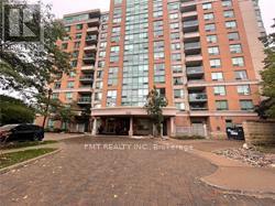 A tall building with many windows is shown in the image.