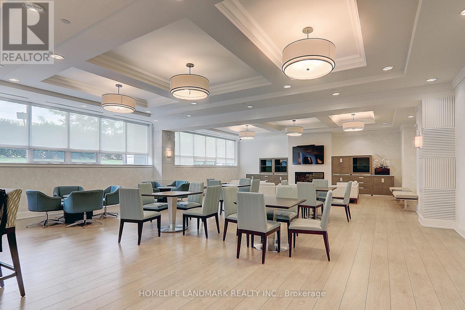 A dining room with a table set for six.