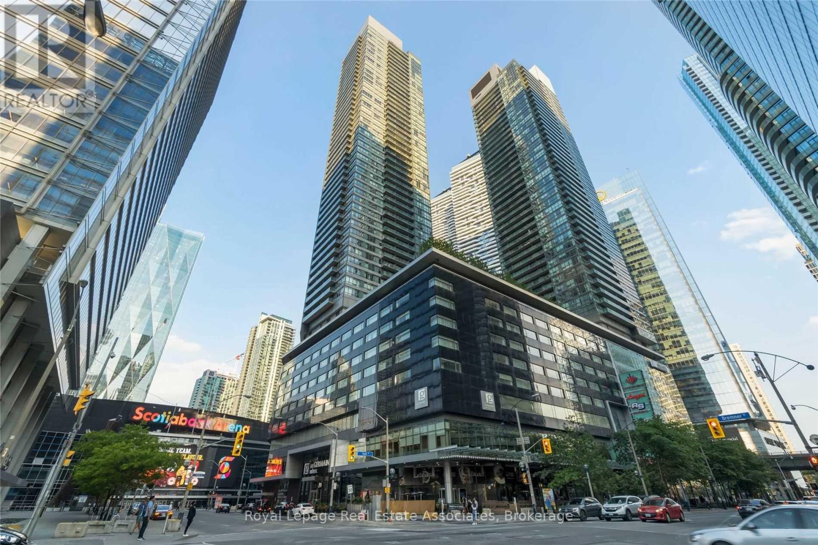 A city street with tall buildings and a Scotiabank sign.