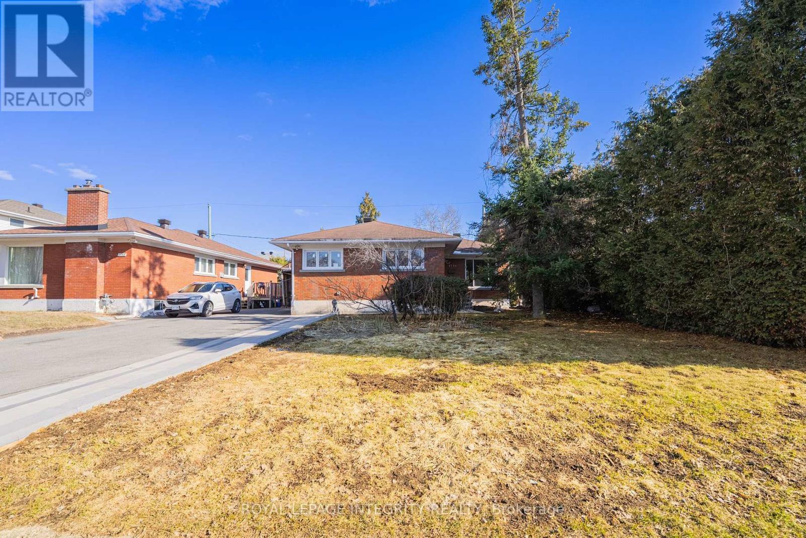 A house with a lawn in front of it.