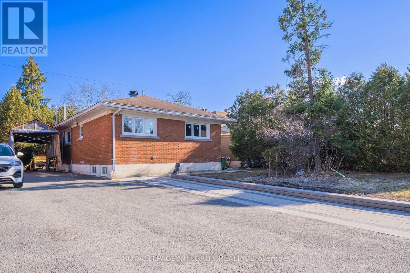 A house with a garage is for sale.