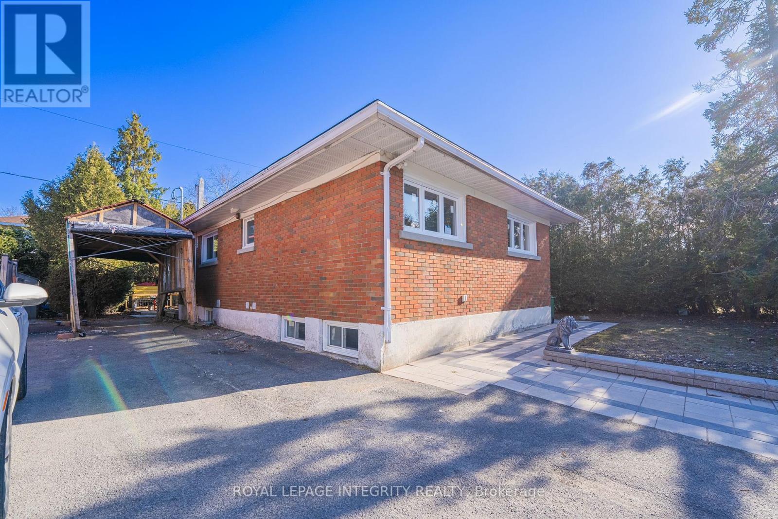 A house with a garage is for sale.