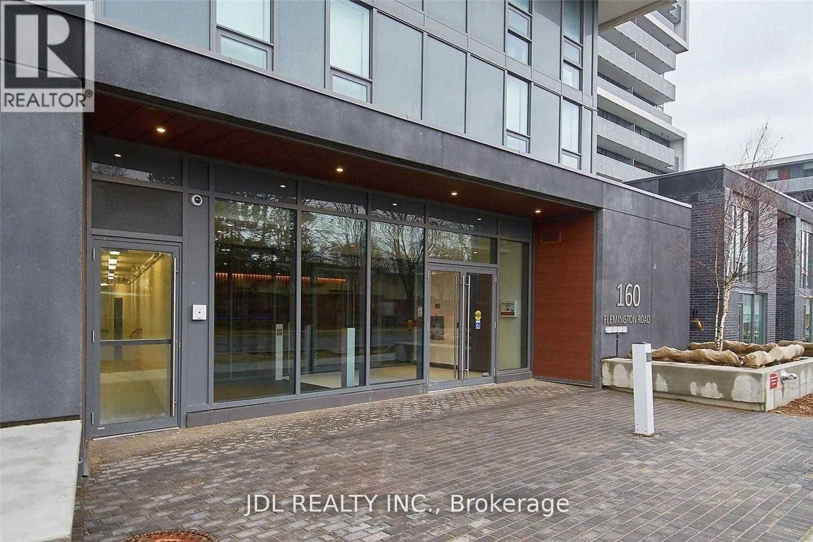 The image shows the front of a building with the sign "JDL REALTY INC, Brokerage" on it.
