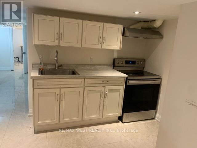 A kitchen with white cabinets and a stainless steel dishwasher.