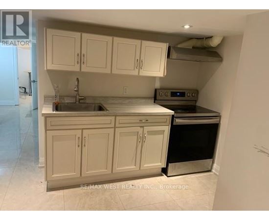 A kitchen with white cabinets and a stainless steel dishwasher.