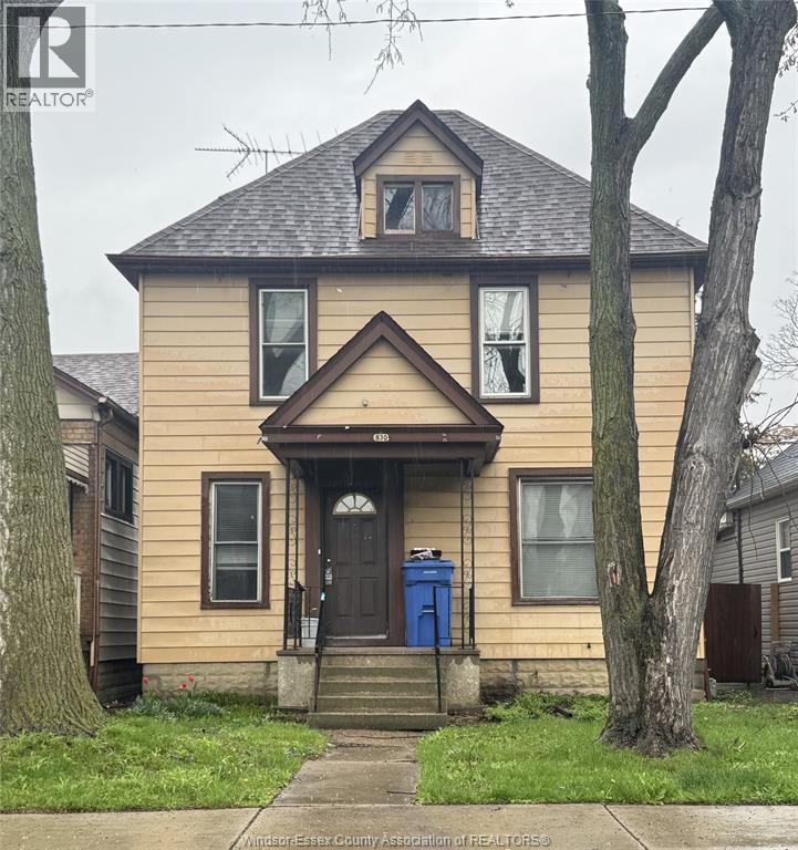 A house with a blue door and a brown roof.