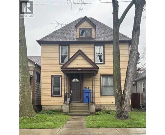 A house with a blue door and a brown roof.
