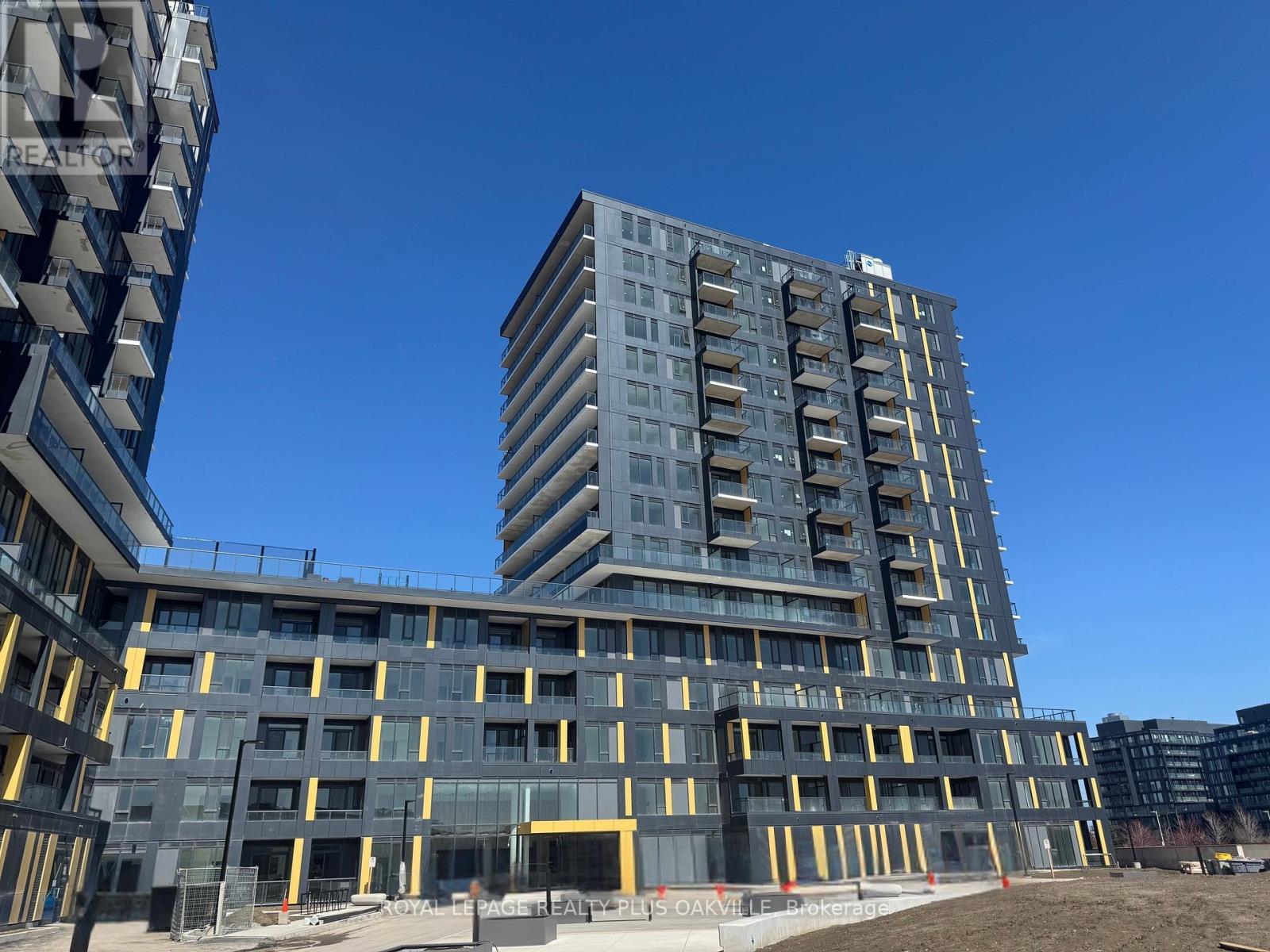 A large building under construction with a clear blue sky in the background.