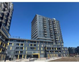 A large building under construction with a clear blue sky in the background.