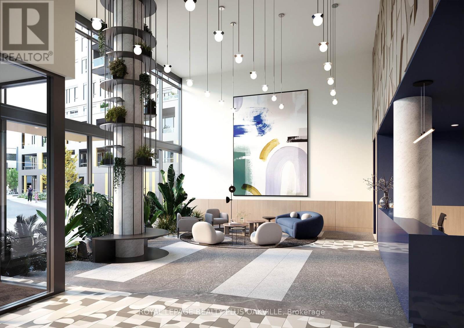 A modern office lobby with a reception desk and a large abstract painting on the wall.