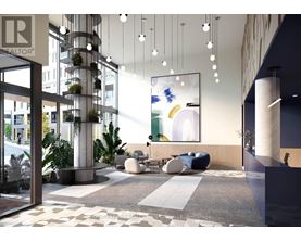 A modern office lobby with a reception desk and a large abstract painting on the wall.