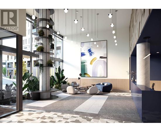 A modern office lobby with a reception desk and a large abstract painting on the wall.