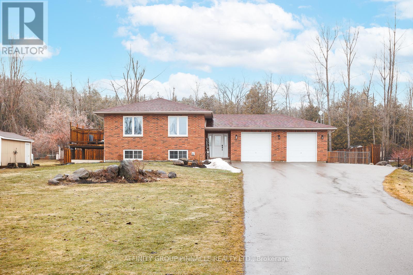 A house with a driveway in front of it.