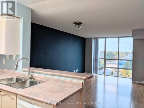 A kitchen with a sink and a window.