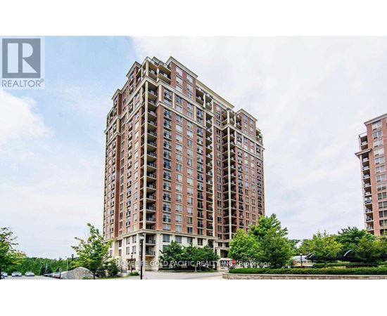 A tall residential building with a sign that reads "Cold Pacific Realty" in front of it.