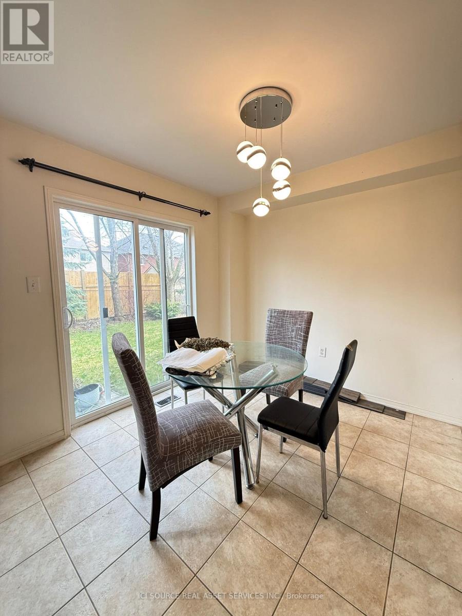 A dining room with a glass table and chairs.